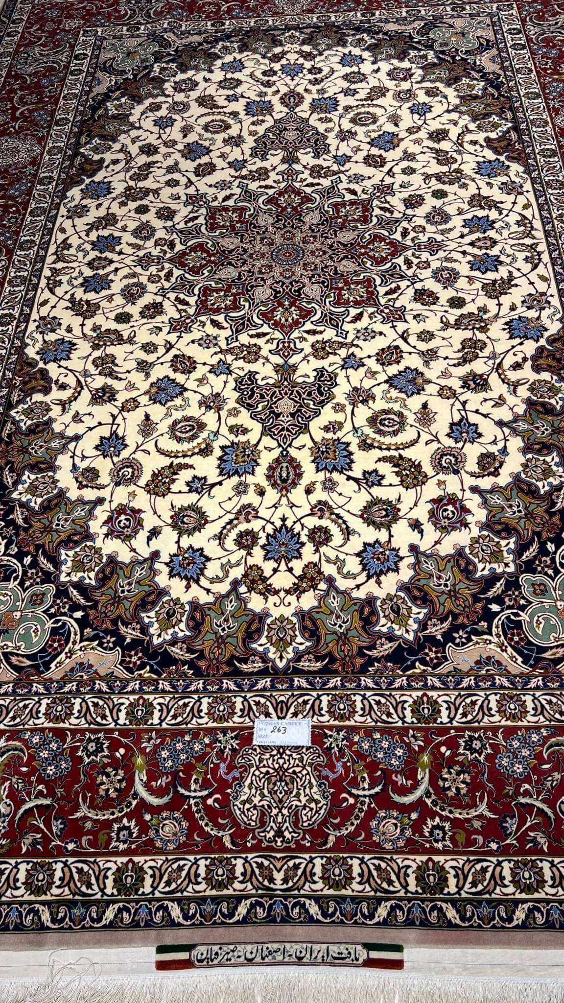 Authentic 8x10 beige and red Persian carpet with floral design